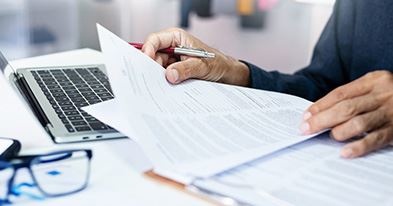 person looking at paperwork